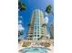 Upscale high-rise condo with pool and palm trees, offering luxurious living and stunning views at 1170 Gulf Blvd # 1006, Clearwater Beach, FL 33767