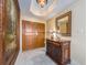 Elegant foyer featuring a decorative table, framed painting, and a warm, inviting ambiance at 1170 Gulf Blvd # 1006, Clearwater Beach, FL 33767