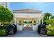 Outdoor kitchen area with built-in grills and seating, perfect for entertaining guests and enjoying the outdoors at 1170 Gulf Blvd # 1006, Clearwater Beach, FL 33767