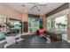 Bright gym with exercise equipment, large windows, and balcony access at 1170 Gulf Blvd # 1006, Clearwater Beach, FL 33767