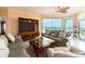 Comfortable living room with stylish furnishings, balcony access, and scenic views at 1170 Gulf Blvd # 1006, Clearwater Beach, FL 33767