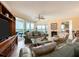 Bright living room featuring cozy seating, balcony access, and serene outdoor views at 1170 Gulf Blvd # 1006, Clearwater Beach, FL 33767
