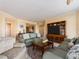 Comfortable living room with plush sofas, stylish decor, and a large entertainment center at 1170 Gulf Blvd # 1006, Clearwater Beach, FL 33767