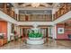 Elegant two-story lobby featuring a beautiful fountain, marble floors, and decorative accents at 1170 Gulf Blvd # 1006, Clearwater Beach, FL 33767