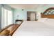 Bright main bedroom with walk-in closet and sliding glass doors opening to a private balcony at 1170 Gulf Blvd # 1006, Clearwater Beach, FL 33767