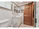 Well-lit bathroom features a white vanity and a mirrored medicine cabinet at 12101 Meadowbrook Ln, Hudson, FL 34667
