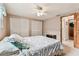 Bedroom featuring built in closets and an en-suite bathroom at 12101 Meadowbrook Ln, Hudson, FL 34667