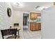 Cozy dining area features a white brick wall adjacent to the kitchen at 12101 Meadowbrook Ln, Hudson, FL 34667