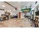 Spacious garage offering ample storage, shelving, and a convenient workbench area at 12101 Meadowbrook Ln, Hudson, FL 34667
