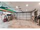 Spacious garage with storage solutions, bicycle, and fan at 12101 Meadowbrook Ln, Hudson, FL 34667