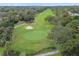 Scenic aerial shot of the well-maintained golf course, surrounded by mature trees at 12101 Meadowbrook Ln, Hudson, FL 34667