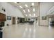 Great room with fireplace and tables with chairs and plenty of light at 12101 Meadowbrook Ln, Hudson, FL 34667