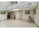 Hallway with restrooms, tables and chairs and paintings at 12101 Meadowbrook Ln, Hudson, FL 34667