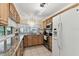 Charming kitchen features tile floors, granite counters and stainless appliances at 12101 Meadowbrook Ln, Hudson, FL 34667