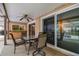 Covered patio with furniture, seamless access to the pool area, and a serene outdoor setting at 12101 Meadowbrook Ln, Hudson, FL 34667