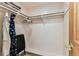 Bright walk-in closet boasts shelves, hanging rods and sleek flooring at 12101 Meadowbrook Ln, Hudson, FL 34667