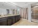 Bathroom featuring a granite countertop, double sinks and separate shower at 12244 Fairlawn Dr, Riverview, FL 33579