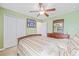 Spacious bedroom with light green walls and a ceiling fan at 12244 Fairlawn Dr, Riverview, FL 33579
