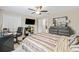 Bright bedroom with a TV, closet and nice dresser near an open doorway at 12244 Fairlawn Dr, Riverview, FL 33579