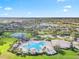 A stunning aerial view of the community pool area, complete with ample seating and verdant landscaping at 12244 Fairlawn Dr, Riverview, FL 33579