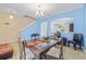 Light-filled dining room with glass table, and pendant lighting at 12244 Fairlawn Dr, Riverview, FL 33579