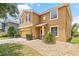 Well-maintained two-story house with manicured landscaping, and a two-car garage at 12244 Fairlawn Dr, Riverview, FL 33579