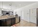 Kitchen with granite countertops and stainless dishwasher opens up to the living area and includes a pantry at 12244 Fairlawn Dr, Riverview, FL 33579
