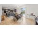 Open dining room leading to a modern kitchen and private pool at 12244 Fairlawn Dr, Riverview, FL 33579