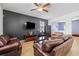Inviting living room with comfortable leather seating at 12244 Fairlawn Dr, Riverview, FL 33579