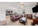 Spacious living room showcases leather furniture, and an open floorplan at 12244 Fairlawn Dr, Riverview, FL 33579