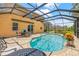 Beautiful screened-in pool with outdoor dining and a well maintained pool at 12244 Fairlawn Dr, Riverview, FL 33579