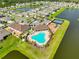 Aerial view of the community amenities including a pool, clubhouse, and tennis courts at 12382 Shining Willow St, Riverview, FL 33579