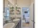 Bathroom featuring dual sinks, ample counter space, great vanity, and easy access to the main bedroom at 12382 Shining Willow St, Riverview, FL 33579