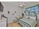 Cozy bedroom with bright natural light, a ceiling fan and a walk-in closet at 12382 Shining Willow St, Riverview, FL 33579