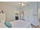 Open bedroom with wood floors leads into a connected bathroom at 12382 Shining Willow St, Riverview, FL 33579