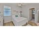 Cozy bedroom with natural light and a view into an additional room at 12382 Shining Willow St, Riverview, FL 33579