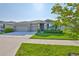 Inviting single-story home with manicured lawn and a spacious two-car garage at 12382 Shining Willow St, Riverview, FL 33579