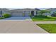 Charming single-story home with well-manicured lawn and neutral exterior at 12382 Shining Willow St, Riverview, FL 33579