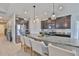 Modern kitchen with granite countertops, stainless steel appliances, and a large island with seating at 12382 Shining Willow St, Riverview, FL 33579