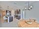 Modern kitchen with stainless appliances, a large island with bar seating, and dark cabinets at 12382 Shining Willow St, Riverview, FL 33579