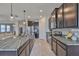 Kitchen features granite countertops, an island with barstool seating, and stainless steel appliances at 12382 Shining Willow St, Riverview, FL 33579