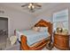 The primary suite has a trey ceiling, elegant furnishings, and wood trim at 12382 Shining Willow St, Riverview, FL 33579