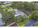 An overhead perspective reveals a screened pool and well-maintained yard of this comfortable home at 1368 Whispering Pines Dr, Clearwater, FL 33764