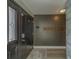 Welcoming entryway featuring a stylish door, modern wall accents, and sleek flooring leading into the home at 1368 Whispering Pines Dr, Clearwater, FL 33764