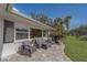 Inviting front porch with comfortable outdoor seating and manicured landscaping creating a relaxing ambiance at 1368 Whispering Pines Dr, Clearwater, FL 33764