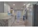 Bright kitchen with stainless steel appliances, white cabinets, and stone countertops for a modern, clean design at 1368 Whispering Pines Dr, Clearwater, FL 33764