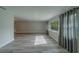 Open living space with sleek flooring and neutral walls providing a bright and airy atmosphere at 1368 Whispering Pines Dr, Clearwater, FL 33764