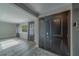 Bright living room with large windows, gray curtains, and modern flooring, creating a cozy and inviting space at 1368 Whispering Pines Dr, Clearwater, FL 33764