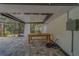 The patio features a dining table and chairs, perfect for enjoying the outdoors in comfort and style at 1368 Whispering Pines Dr, Clearwater, FL 33764