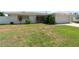 Well maintained exterior showing manicured landscaping, green lawn, and welcoming curb appeal at 13898 Jamaica Dr, Seminole, FL 33776